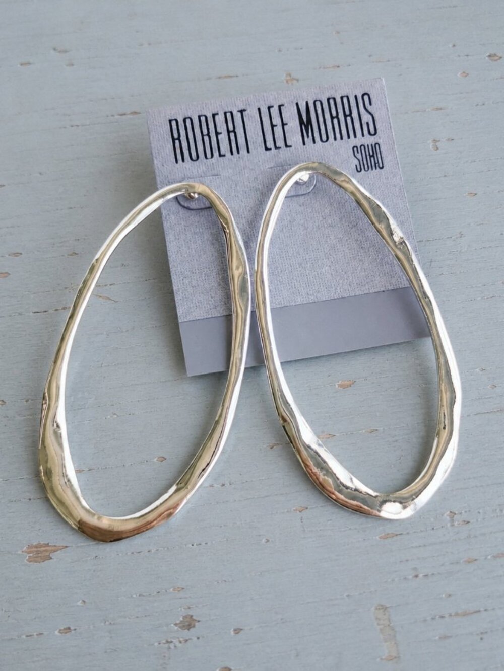 silver plated elongated oval hoop earrings